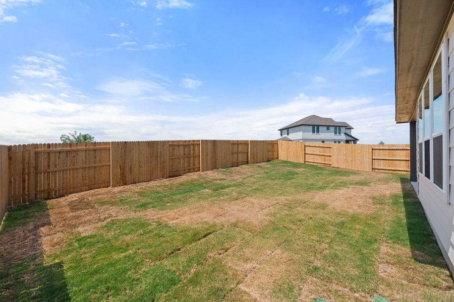 Exterior details and patio area of a home in Terrace Collection At Turner's Crossing, Buda (Image 30).