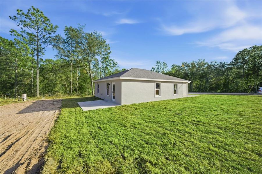Exterior details and patio area of a home in , Williston (Image 4).