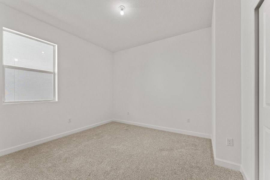 Spacious, unfurnished interior of a new home in Tradition - Cadence, Port St. Lucie (Image 14).