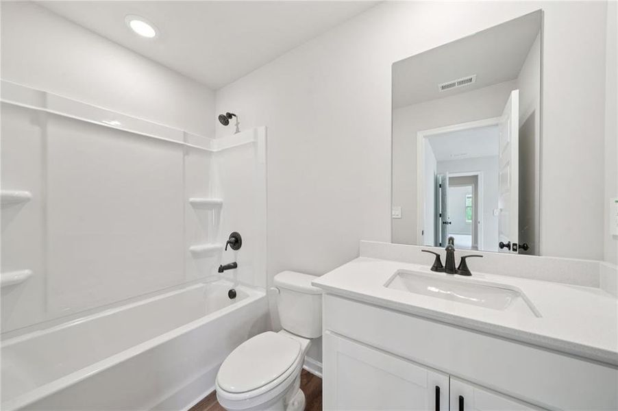 Furnished interior view inside a new home in Vines at Mill Creek - Estate Series, Braselton (Image 14).