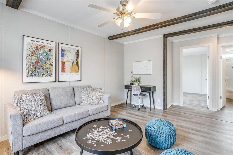 Living room featuring ceiling fan and wood-type flooring