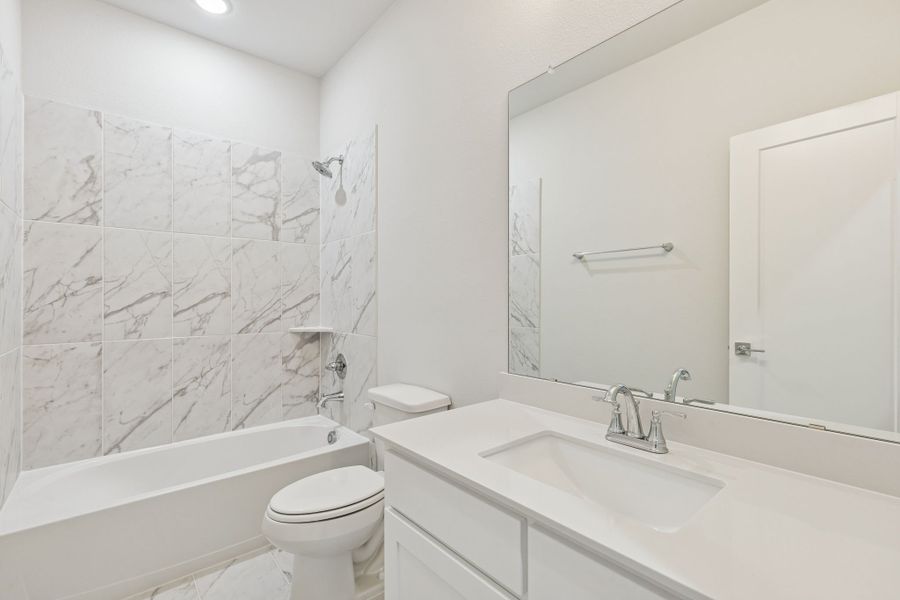 Bathroom in the Masters home plan by Trophy Signature Homes – REPRESENTATIVE PHOTO