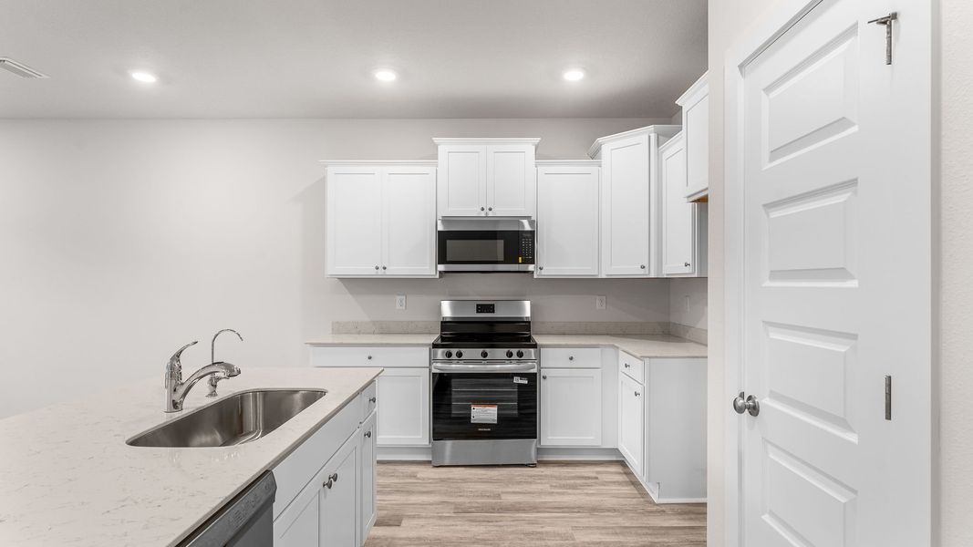 Representative furnished interior of a home built from the Palm Interior by D.R. Horton in Genoa Landing Townhomes, Freeport (Image 6).