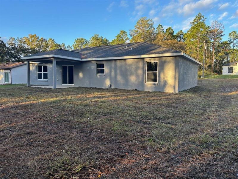 Exterior details and patio area of a home in , Citrus Springs (Image 4).