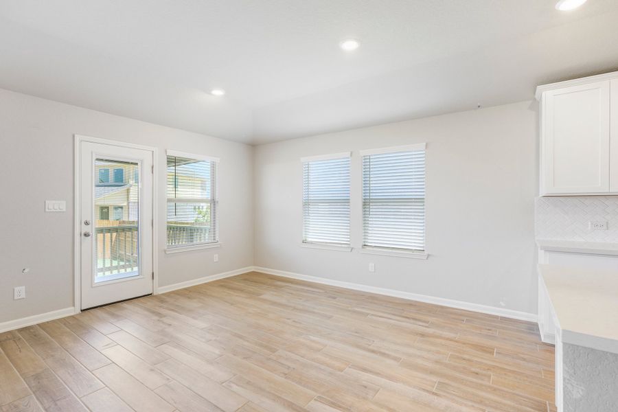 Dining room in the Fitzhugh floorplan at a Meritage homes community.