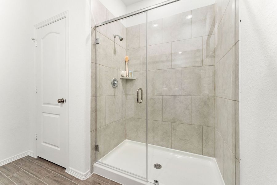 A bathroom with a glass shower.