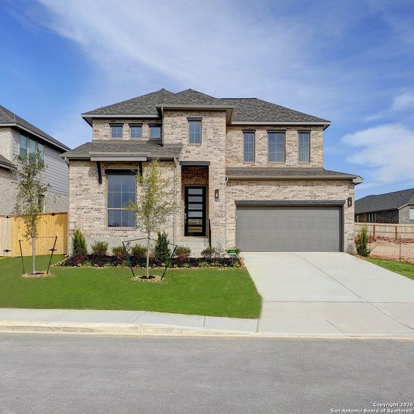 Front exterior of a new home in Ladera 50', San Antonio, TX, highlighting curb appeal (Image 2).