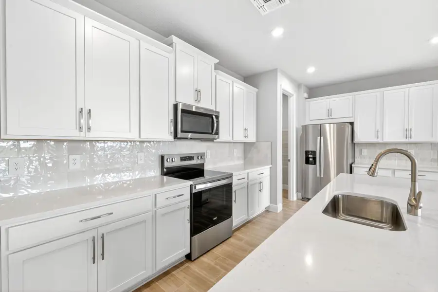 Furnished interior view inside a new home in Windwater, Parrish (Image 3).