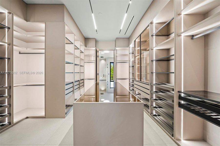 Primary walk-in closet Primary walk-in closet