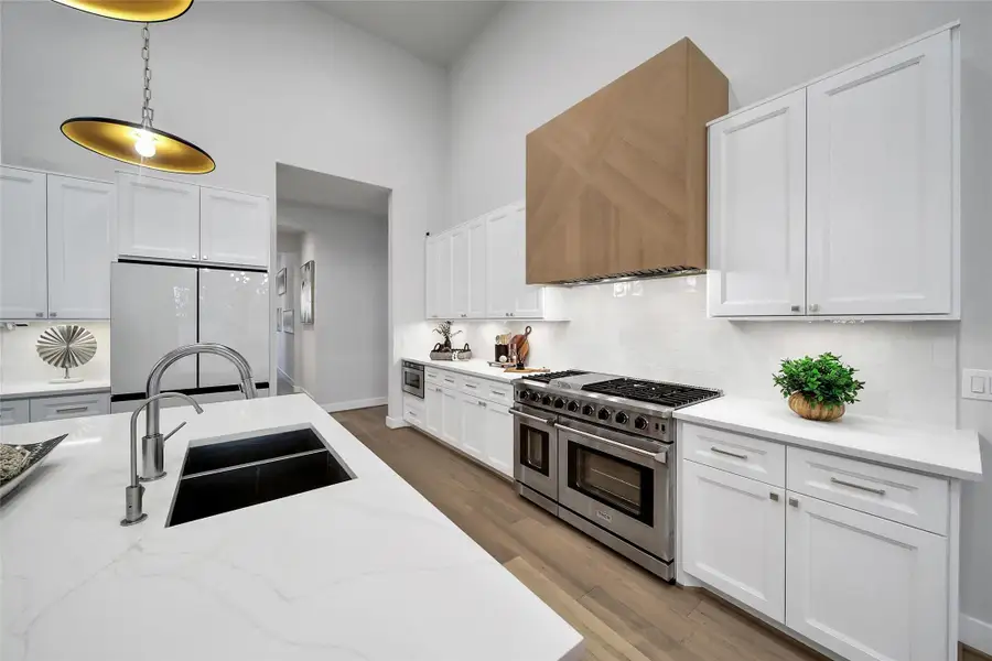 Furnished interior view inside a new home in ARTAVIA, Conroe (Image 37).