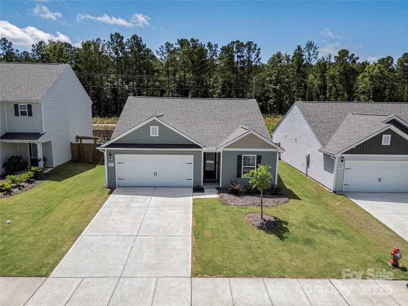 Front exterior of a new home in Knights Bridge, Richburg, SC, highlighting curb appeal (Image 1).