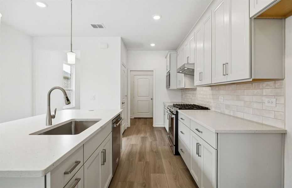 Spacious kitchen with eat-in bar top island