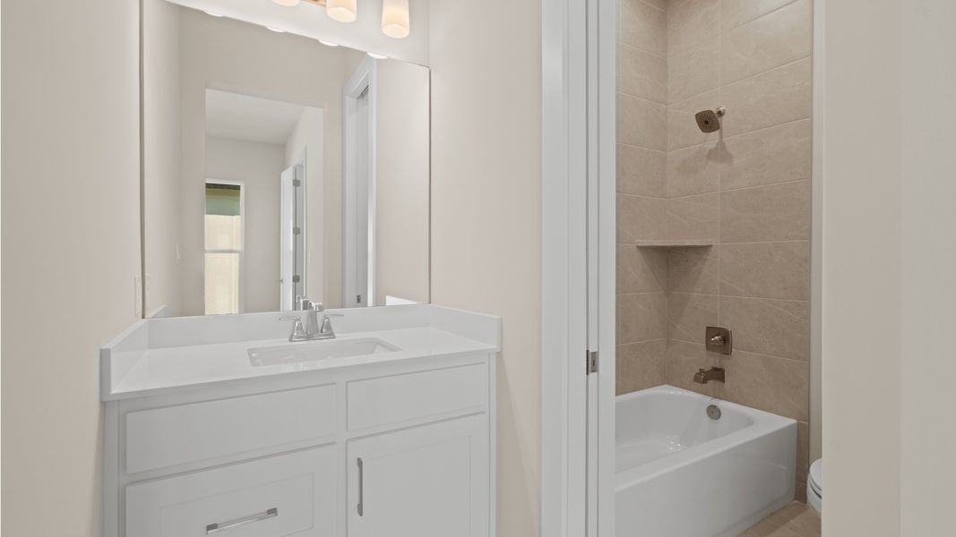Furnished interior view inside a new home in Glynlea Country Club, Port St. Lucie (Image 8).