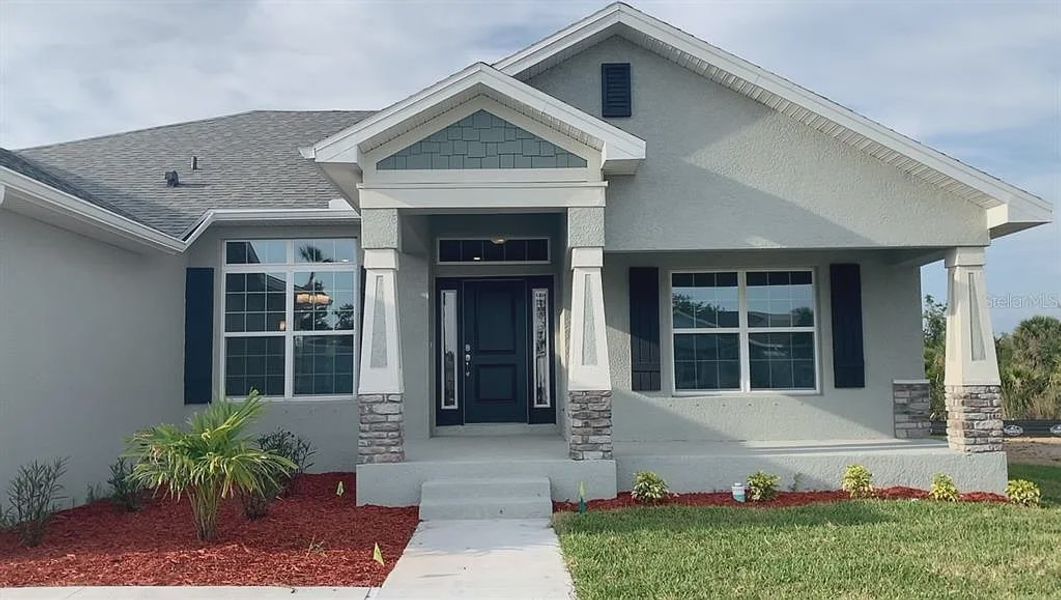 Front exterior of a new home in South Gulf Cove, Port Charlotte, FL, highlighting curb appeal (Image 2). Front exterior of a new home in South Gulf Cove, Port Charlotte, FL, highlighting curb appeal (Image 2).