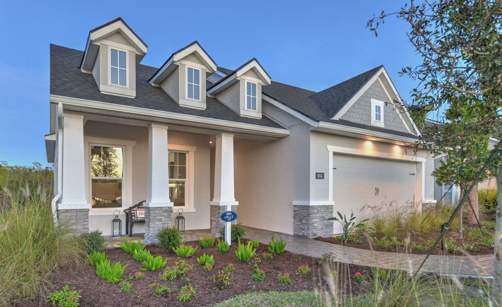 Front exterior of a new home in Mosaic, Daytona Beach, FL, highlighting curb appeal (Image 1). Front exterior of a new home in Mosaic, Daytona Beach, FL, highlighting curb appeal (Image 1).