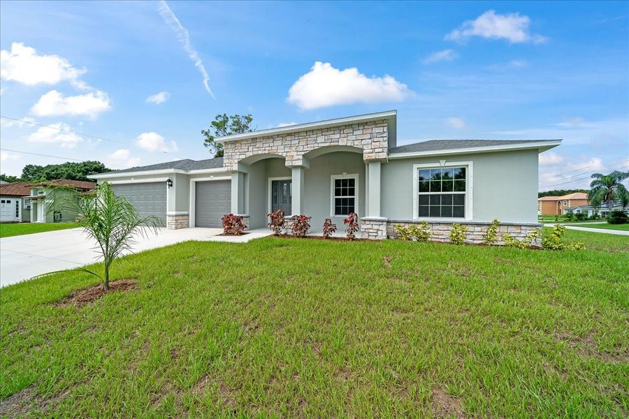 Representative exterior photo of a completed home built from the The Newport by Avtec Homes in Palm Bay & South Brevard, Palm Bay, FL (Image 26).