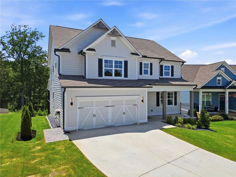 Front exterior of a new home in , Woodstock, GA, highlighting curb appeal (Image 1). Front exterior of a new home in , Woodstock, GA, highlighting curb appeal (Image 1).
