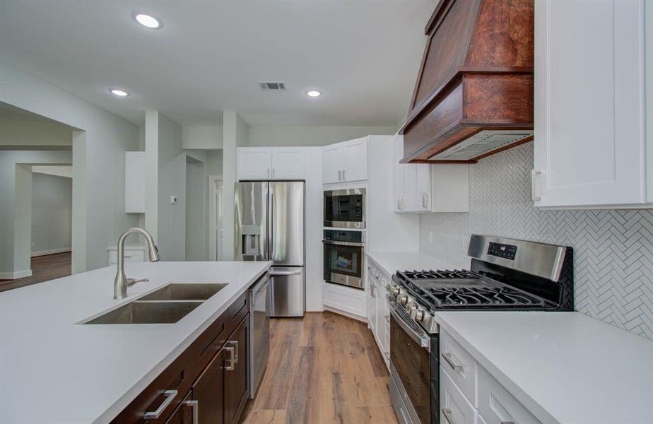 Delicate white granite countertops in this chefs kitchen