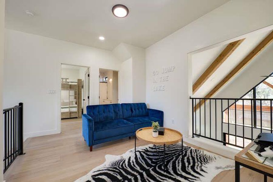 Living room featuring wood finished floors and recessed lighting