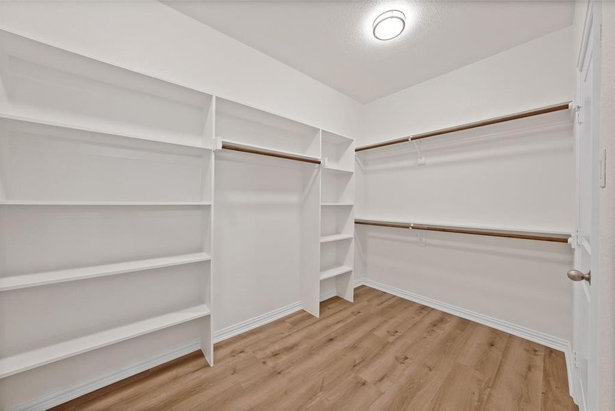 Very big primary closet with lots of built-in shelving! Very big primary closet with lots of built-in shelving!