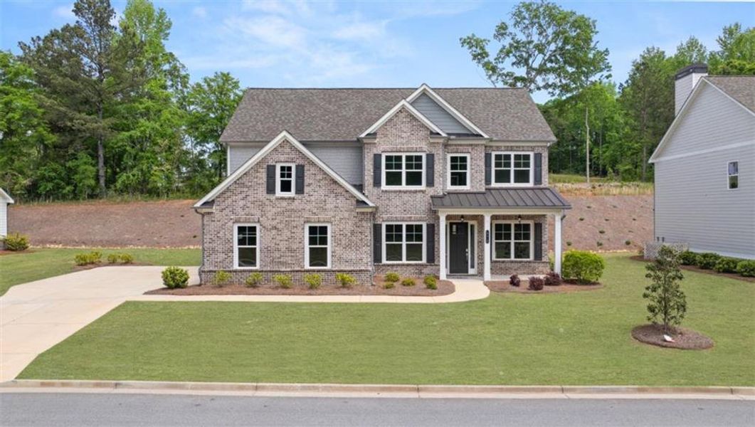 Front exterior of a new home in Traditions of Braselton, Jefferson, GA, highlighting curb appeal (Image 2). Front exterior of a new home in Traditions of Braselton, Jefferson, GA, highlighting curb appeal (Image 2).