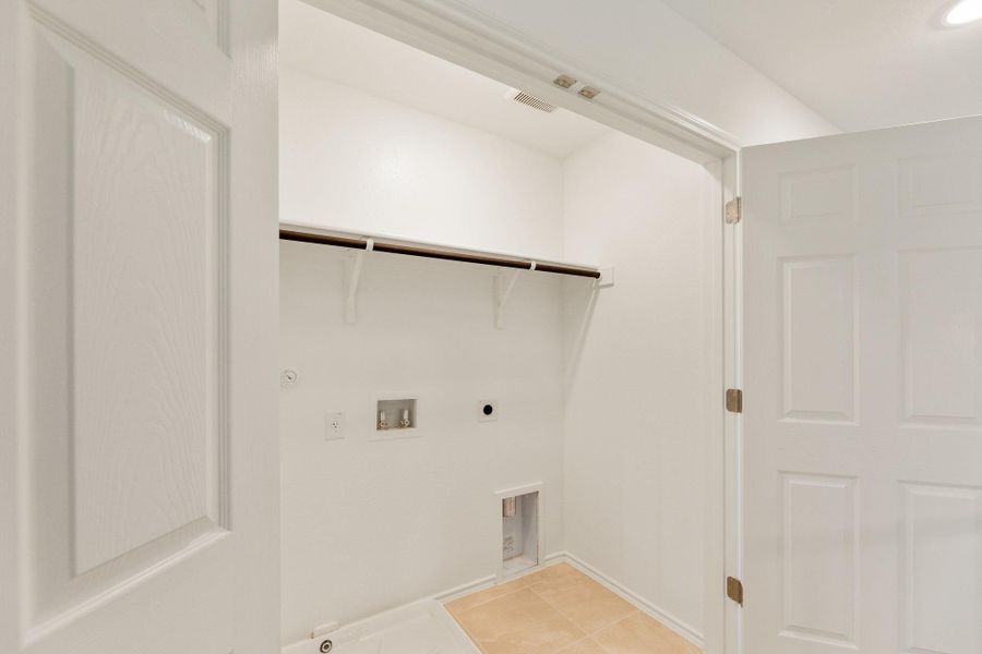 Laundry area with washer hookup, gas dryer hookup, and electric dryer hookup