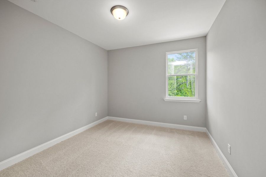 Representative unfurnished interior of a home built from the Glynn by UnionMain Homes in Austin Springs, Bethlehem (Image 20).