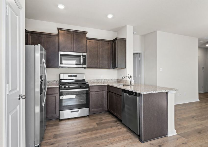 The kitchen has sprawling granite countertops.