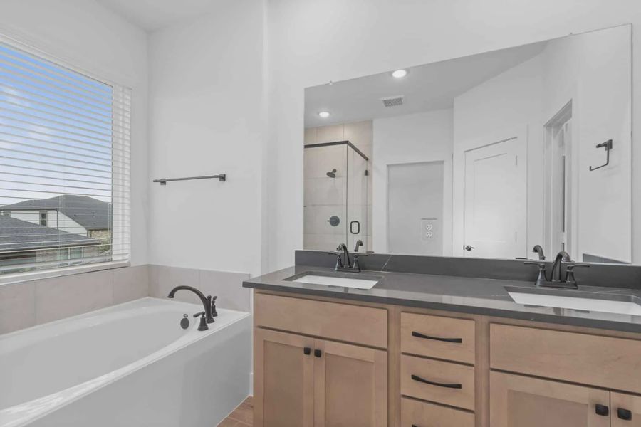 Representative furnished interior of a home built from the Chantilly 2 by Chesmar Homes in Meridiana Chateau, Manvel (Image 4).