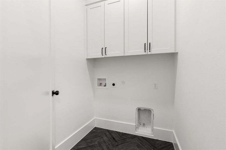 A second utility closet with full size connections adds extra storage space for convenience.