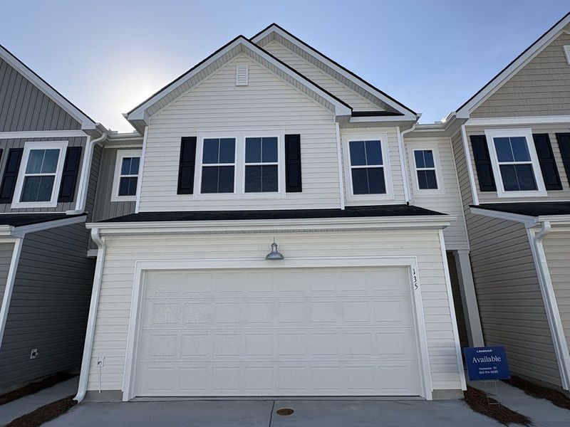 Front exterior of a new home in Dawson Pointe, Summerville, SC, highlighting curb appeal (Image 1). Front exterior of a new home in Dawson Pointe, Summerville, SC, highlighting curb appeal (Image 1).