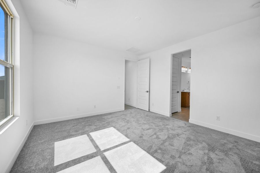 Representative unfurnished interior of a home built from the Caliber by Taylor Morrison in Artisan at Asante, Surprise (Image 27). Representative unfurnished interior of a home built from the Caliber by Taylor Morrison in Artisan at Asante, Surprise (Image 27).