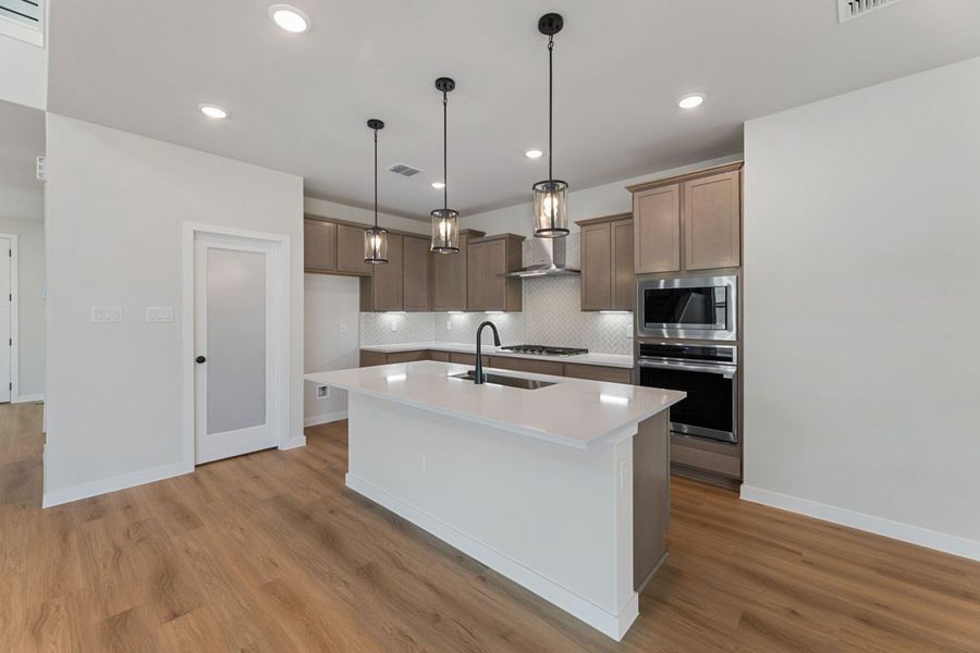 Representative furnished interior of a home built from the Poinsettia by Hakes Brothers in Hickory Ridge Estates, Elmendorf (Image 7).