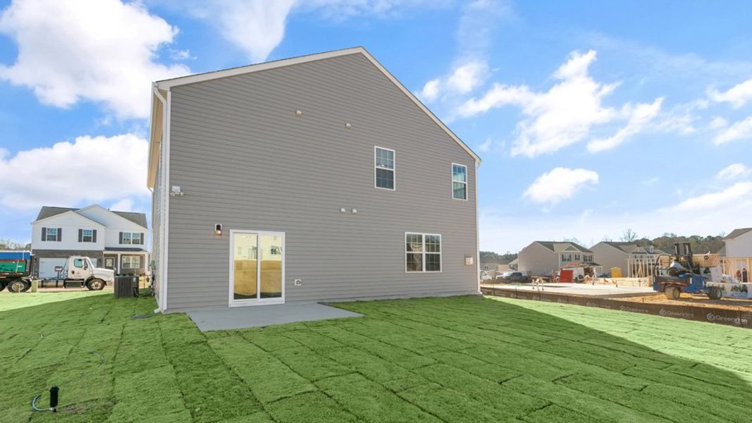 Exterior details and patio area of a home in Ridgewood Farms, Winterville (Image 21).
