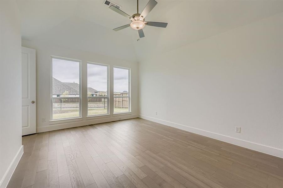Main bedroom featuring light wood-type flooring and ceiling fan Main bedroom featuring light wood-type flooring and ceiling fan