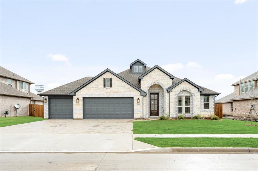 Front exterior of a new home in Waverly Estates, Nevada, TX, highlighting curb appeal (Image 2).
