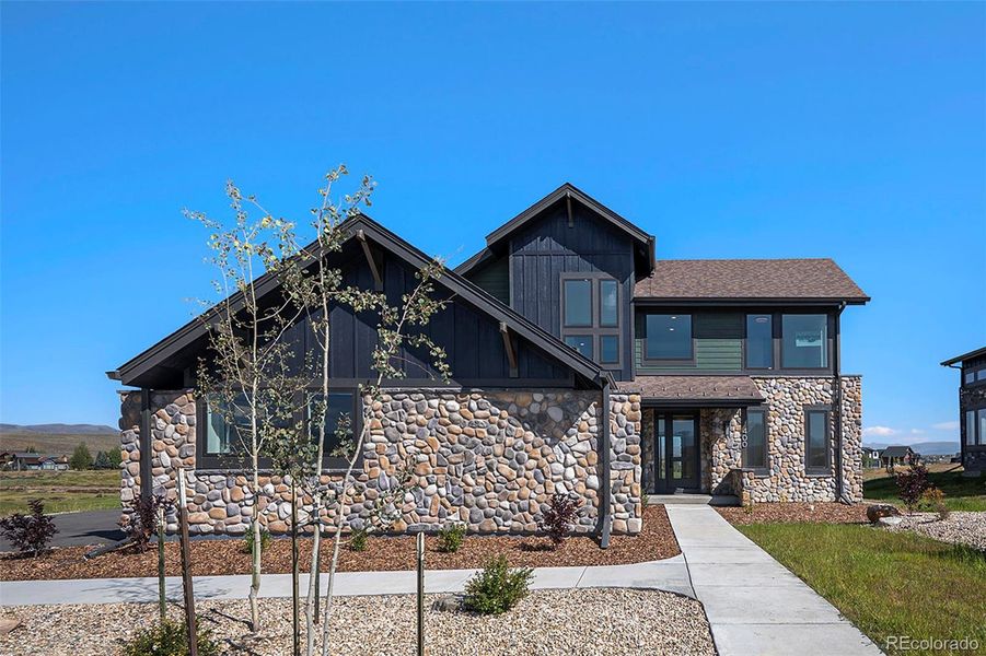 Front exterior of a new home in , Granby, CO, highlighting curb appeal (Image 13).