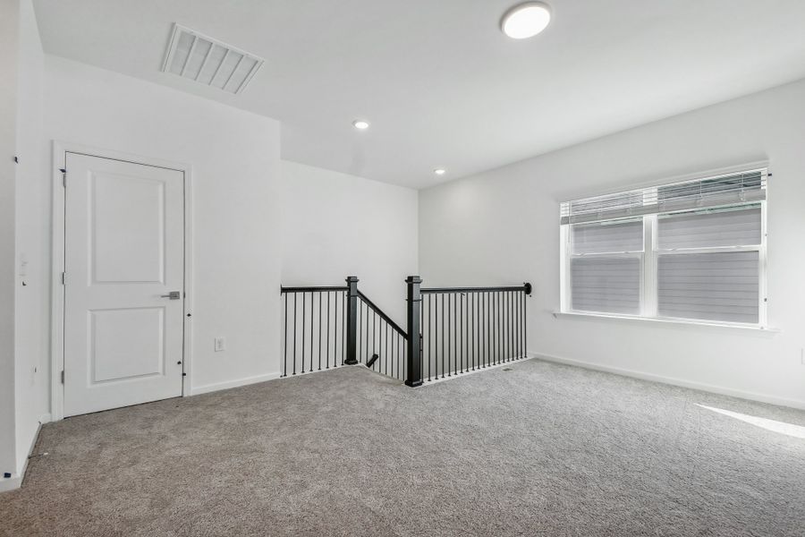 Representative unfurnished interior of a home built from the Macon by Ashton Woods in Rowland's Grant, Fuquay Varina (Image 18).