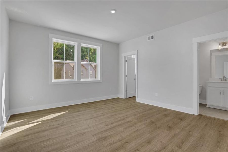 Spacious, unfurnished interior of a new home in The Paddocks at Doc Hughes, Buford (Image 18).