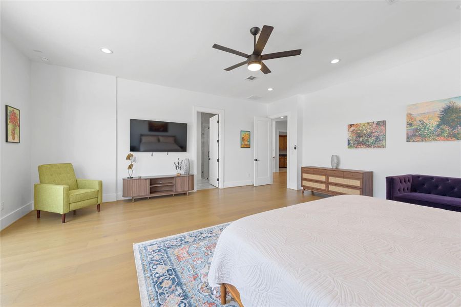 Extremely spacious primary bedroom with enough room for any combination.