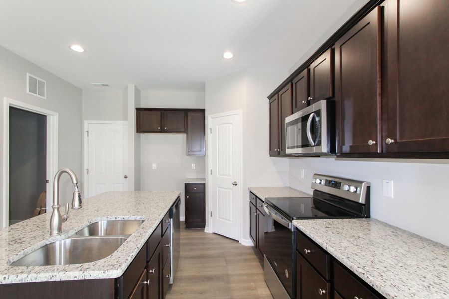 Representative furnished interior of a home built from the Nicklaus by RiverWILD Homes in Riverwood Ranch, Clayton (Image 10).