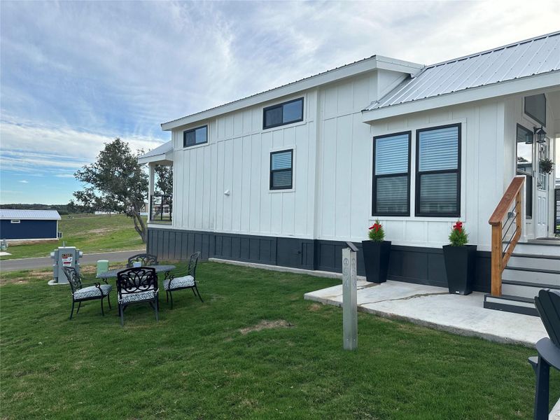 Front exterior of a new home in , Fredericksburg, TX, highlighting curb appeal (Image 1).
