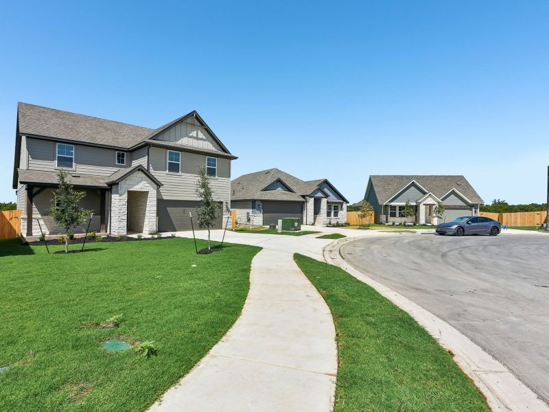 Front exterior of a new home in Butler Farms - Boulevard Collection, Liberty Hill, TX, highlighting curb appeal (Image 2). Front exterior of a new home in Butler Farms - Boulevard Collection, Liberty Hill, TX, highlighting curb appeal (Image 2).