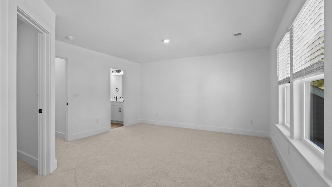 Primary suite that offers first-rate relaxation with established style and elevated finishes