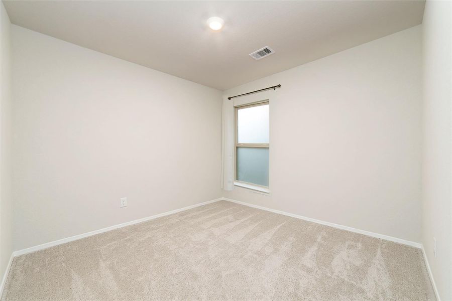Virtually staged secondary bedroom with natural light and flexible space.