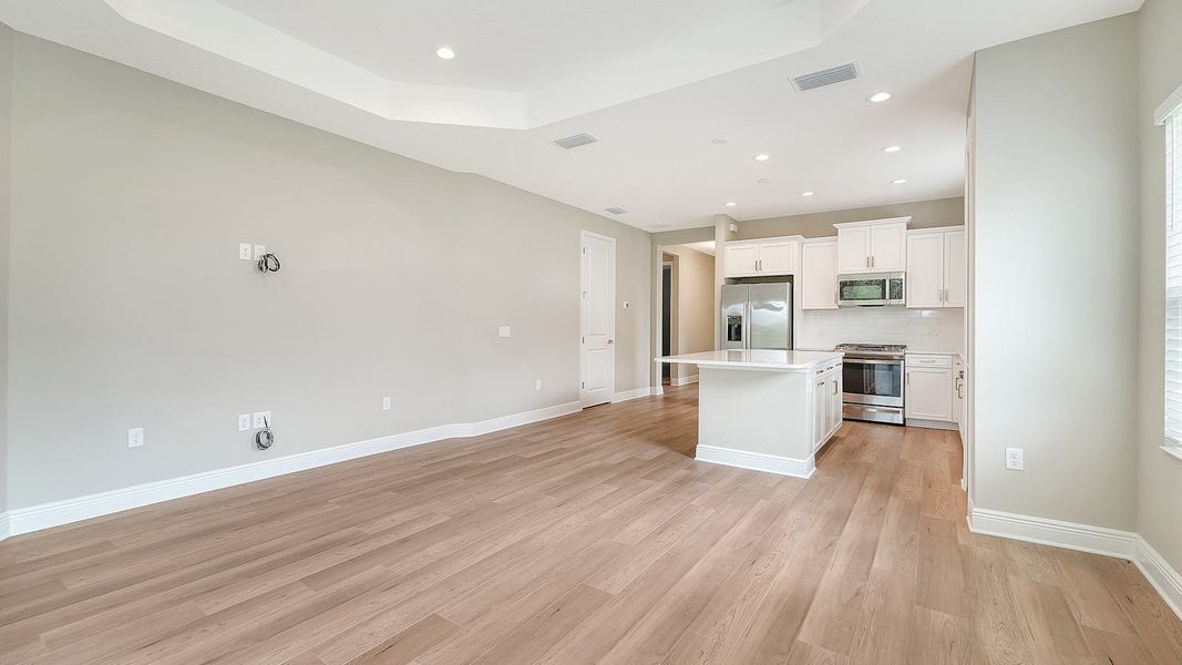 Spacious, unfurnished interior of a new home in Wildleaf Real Estate and Homes for Sale in Parrish, FL - Neal Communities, Parrish (Image 30).