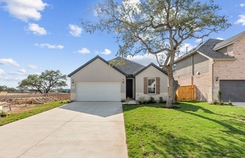 Front exterior of a new home in Woodside, Georgetown, TX, highlighting curb appeal (Image 18).