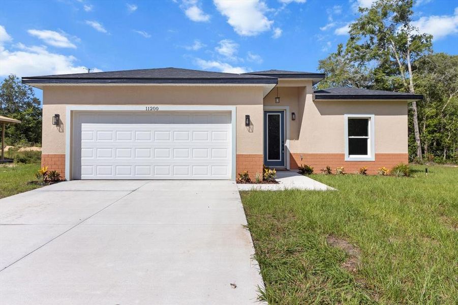 Front exterior of a new home in , Citrus Springs, FL, highlighting curb appeal (Image 18).