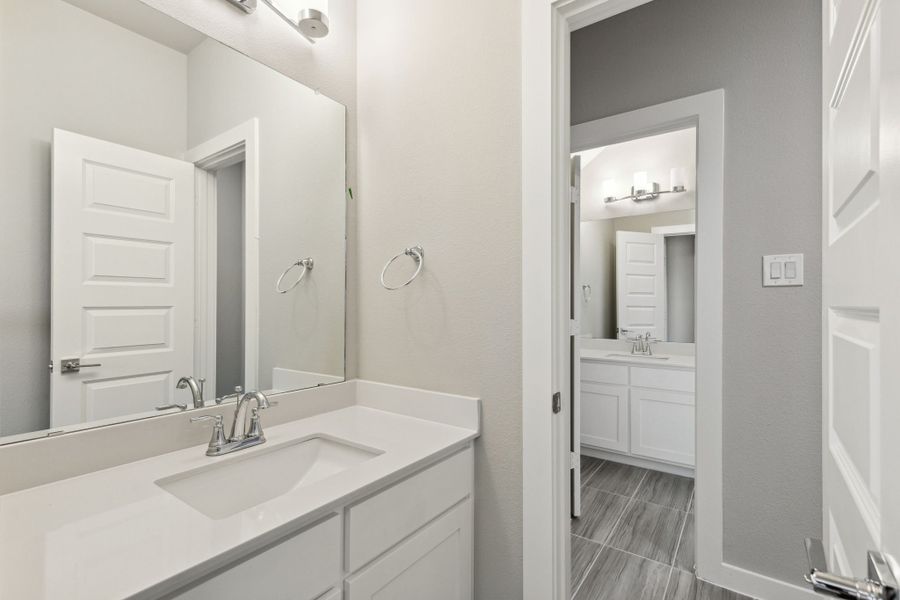 Bathroom in the Morrison home plan by Trophy Signature Homes – REPRESENTATIVE PHOTO