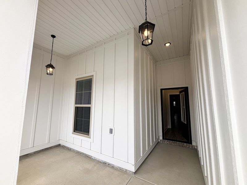 Exterior details and patio area of a home in Bird Song at Hammock Bay, Freeport (Image 3).